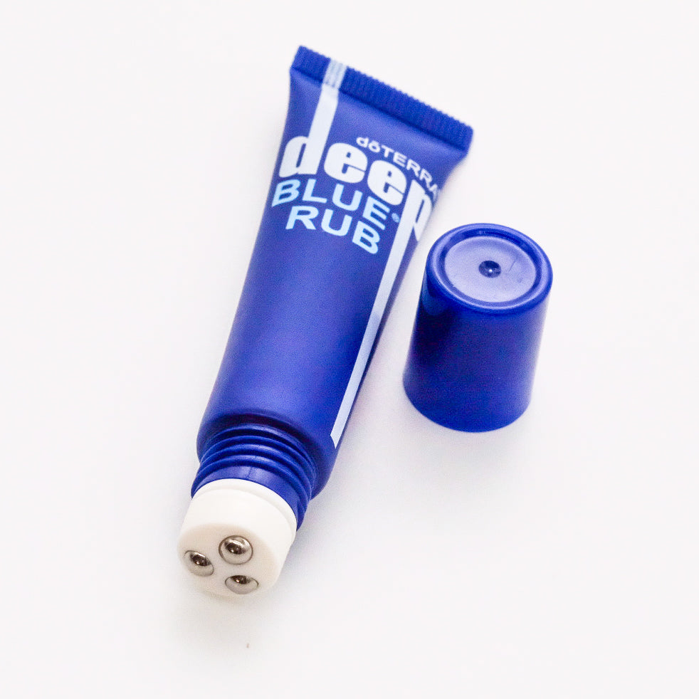 Deep blue empty tube with massage ball