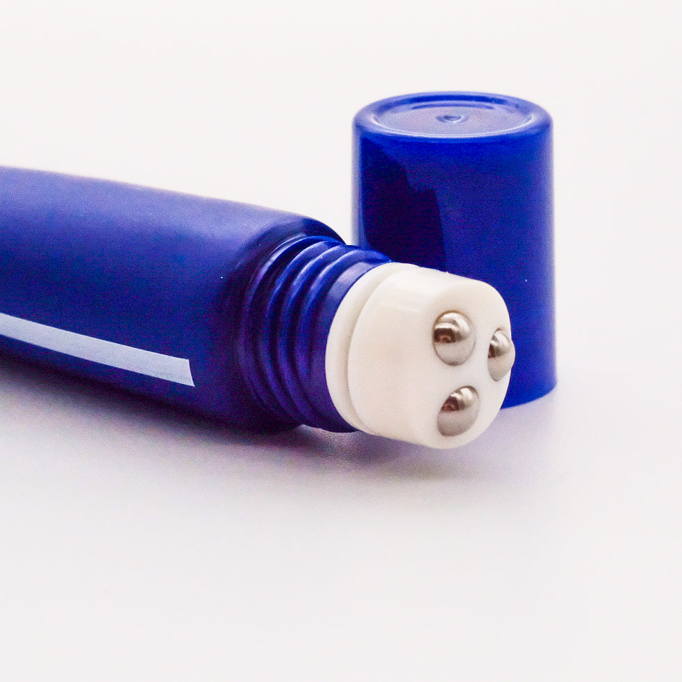 Deep blue empty tube with massage ball
