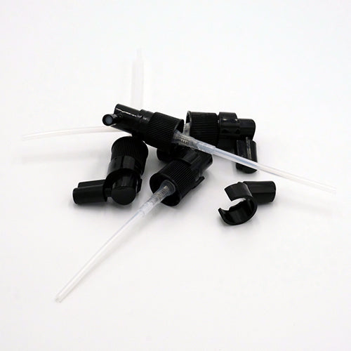Bouchon vaporisateur pour la gorge démonté, avec capuchon en acrylique pour protection.