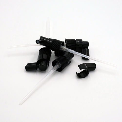 Bouchon vaporisateur pour la gorge démonté, avec capuchon en acrylique pour protection.