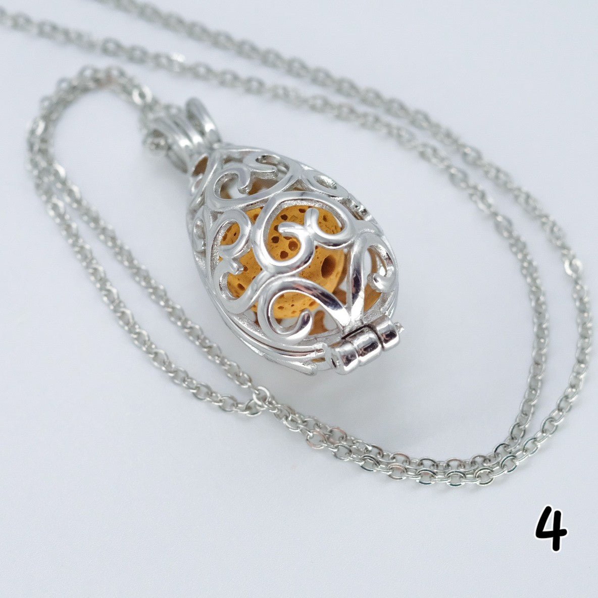 Collier d'aromathérapie goutte d'eau en acier inoxydable et pierre de lave