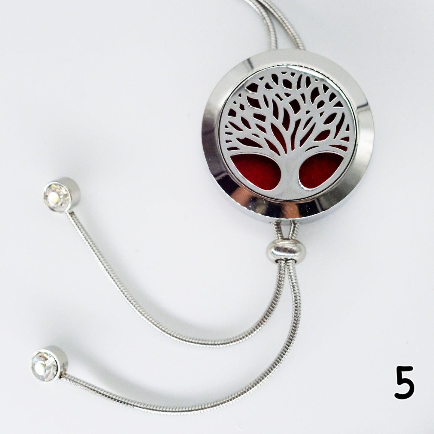 Round stainless steel aromatherapy necklace with a long chain 