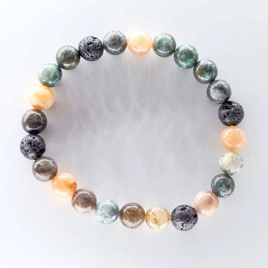 Bracelet diffuseur d'huiles essentielles modèle Amazon, fait main au Québec avec des pierres naturelles de pierre de soleil noire, pierre de soleil et agate Crazy Lace verte, proposé par Essanzia.