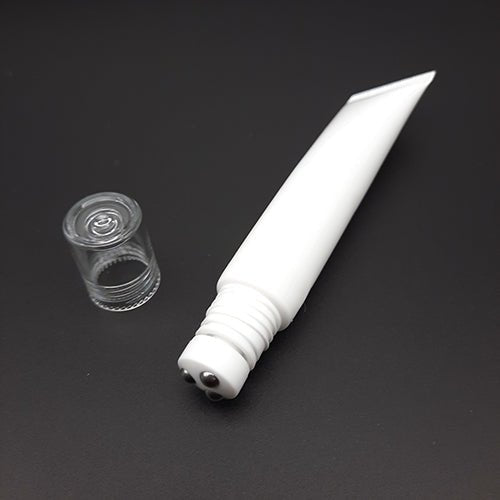Empty tube with massage ball